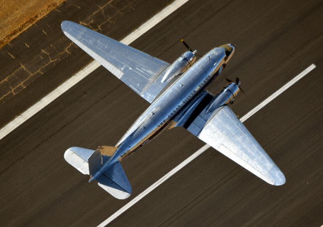 Douglas DC-3 (N18121) - N18121 is the highest time DC-3 in the world, with over 91,690 total hours on her airframe. Sadly,this will be her last flight before being stripped of her Eastern Airlines paint. For the foreseeable future, she will appear totally naked in polished bare metal. After that, who knows?