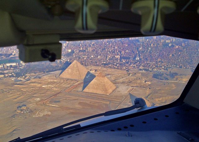 — — - Giza pyramids while on final approach to Cairo on 1/24/2011.  The riots started the next day as we watched from our hotel balcony overlooking Tahir Square.