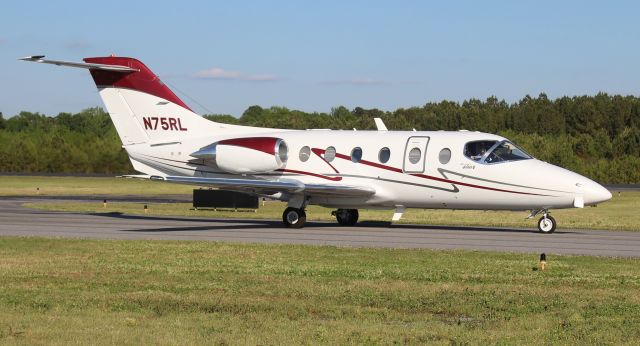 Beechcraft Beechjet (N75RL) - A 2001 model Beechcraft Beechjet 400A taxiing for departure at Boswell Field, Talladega Municipal Airport, AL, following the NASCAR GEICO 500 race at Talladega Super Speedway - April 25, 2021.