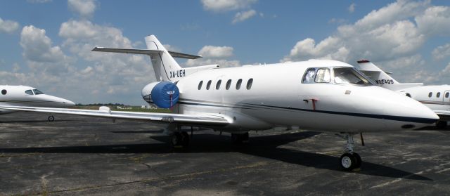 Hawker 800 (XA-UEH) - A Hawker 800 (XA-UEH) sits on the ramp at Blue Grass Airport (KLEX) awaiting the next days journey southward...