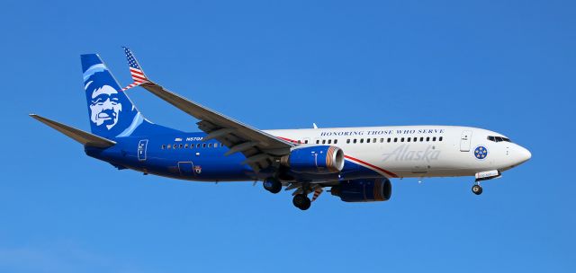 Boeing 737-800 (N570AS) - Alaska's N570AS, dressed in the absolutely wonderful red, white and blue "Honoring Those Who Serve" ultra gorgeous special paint that pays tribute to every person of all backgrounds and beliefs who is now serving or who has ever served in any branch of the United States Armed Forces, is captured as it is on short final to Reno Tahoe International's Runway 16R.br /* * *  See COMMENT below * * *