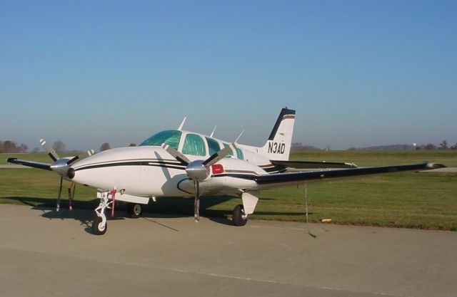 Beechcraft Baron (58) (N3AD) - Parked on ramp in front of DCFS Hangar...