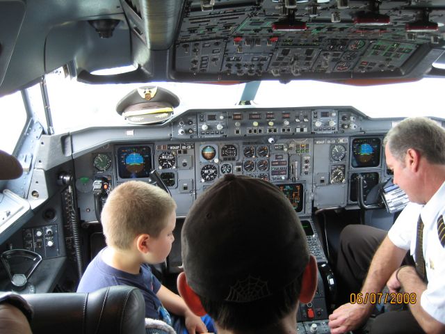 — — - Inside the Airbus A300-600F flight deck. The pilot is getting the local KRFD ATIS.