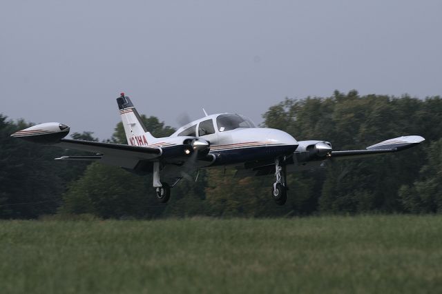 Cessna 310 (N21HA) - N21HA Landing on runway 14.