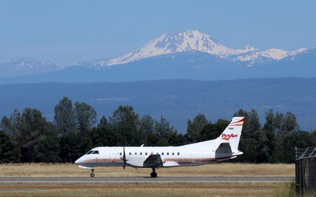 Saab 340 (N404XJ) - KRDD - SAAB 340 of PenAir departing Redding for Portland Oregon with beautiful Mt Lassen in Lassen Volcanic National Park-looming in the hot sun 50 miles to the east. June 2, 2016