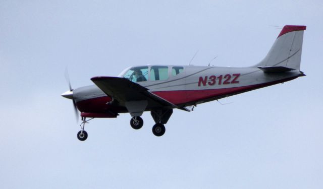 Beechcraft Bonanza (33) (N312Z) - On final is this 1960 Beechcraft Bonanza 35-33 Debonair in the Autumn of 2019.