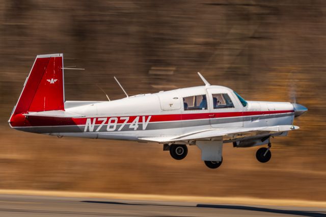 Mooney M-20 (N7874V) - Mooney M-20P N7874V taking off from KLOM (Wings Field)br /1/60 sec. f/16 500mm ISO 64