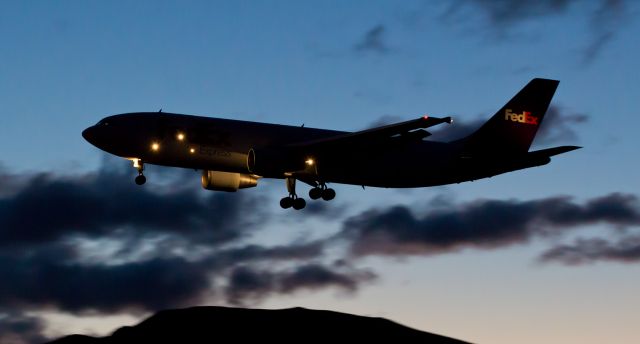 Airbus A300F4-600 (N745FD) - FDXs "Vale" is captured here as it is arriving from Memphis just as dawn is breaking over Reno Tahoe International and the Truckee Meadows.