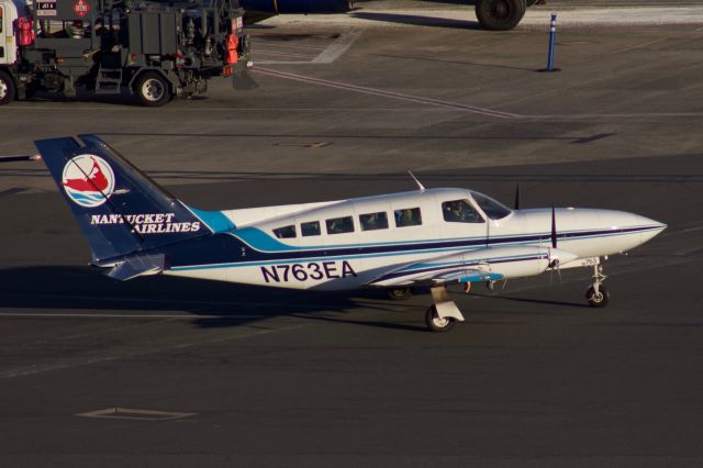 Cessna 402 (N763EA) - (02/21/2020) N763EA wearing the Nantucket Airlines Special Livery, leaves  the Cape Air ramp at BOS during the golden hour.