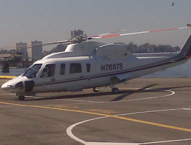 Sikorsky S-76 (N7667S) - Sikorsky s-76C at Manhattans West 30th Street heliport Sept. 21, 2008. Photo taken with Blackberry 8310.