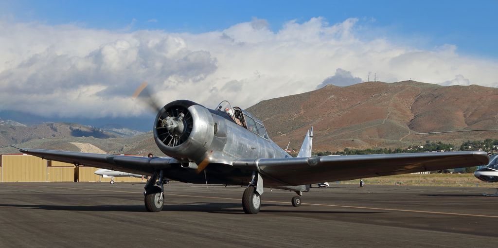 N717UP — - This North American T-6G (N717UP) is one of about a dozen aircraft owned by the Cactus Air Force Wings and Wheels Museum (Carson City, Nevada) that were displayed at the annual Carson City Airport (KCXP) Open House last Saturday.  This is the first photo of N717UP to be entered in the FA gallery and it shows the unpainted Texan being taxied into a display location on the KCXP ramp a few minutes before the official start of the open house event.