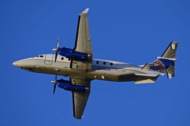 Beechcraft 1900 (N81538) - After takeoff from 27R