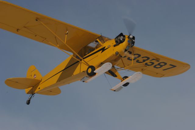 — — - Piper Cub Flies Over Photographer at  EAA Ski Plane Fly-In