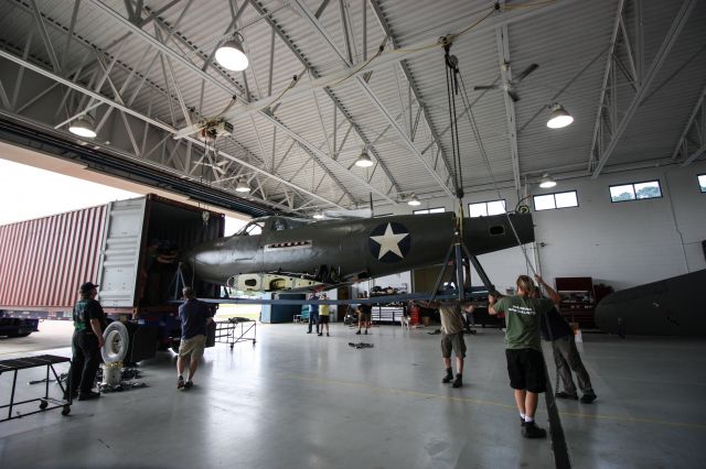 Bell Airacobra (N39FF) - The Fighter Factory and Precision Aero unload the Military Aviation Museum's Bell P-39F Airacobra (serial #41-7215) on Friday, May 17, 2019