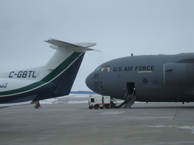 Pilatus PC-12 (C-GBTL) - PC12 and C-17 Parked at Woodward Aviation FBO ,Goose Airport NL,April 2/09