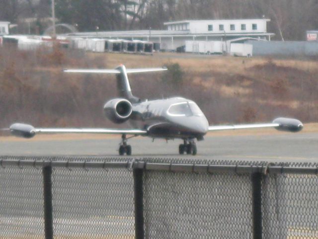 Learjet 35 (N388PD) - Taxiing in. You can see Airport Trailer Sales on the hill in the background.