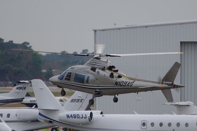 SABCA A-109 (N109AG) - Landing on the Sheltair Ramp, on another heli-shuttle run from KXFL for the Daytona 500.