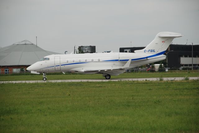 Bombardier Challenger 300 (C-FGIL) - Skyservice Challenger 300 visiting Bombardier plant at Downsview Airport Toronto, July 11/08. Aircraft back tracking to make full use of the runway.