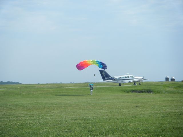 Cessna 402 (N2714M) - Cape Air taking off with a skydiver touching down at an EAA Chapter 540 flying a few years ago