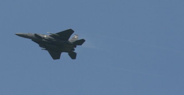 McDonnell Douglas F-15 Eagle — - F-15 Eagle. I was driving north out of Destin passing Eglin AFB where they had numerous jets performing touch & gos. I pulled over and took photos of this impromptu airshow.