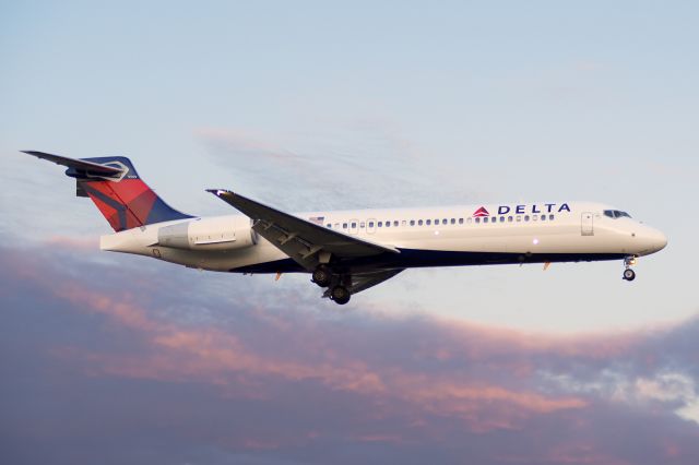 Boeing 717-200 (N932AT) - Short final on 19R about 10 minutes after sunset. Nikon D750 at high ISO. 2/22/2015.