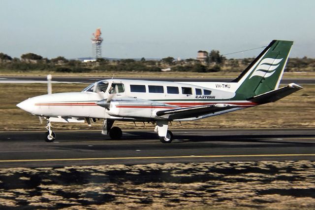 VH-TMU — - EASTERN AUSTRALIA AIRWAYS - CESSNA 404 - REG : VH-TMU (CN 404-0205) - KINGSFORD SMITH SYDNEY NSW. AUSTRALIA - YSSY 27/6/1988 35MM SLIDE CONVERSION USING A LIGHTBOX AND A NIKON L810 DIGITAL CAMERA IN THE MACRO MODE.