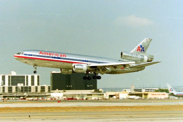 McDonnell Douglas DC-10 (N119AA) - KLAX American "10 Heavy" over the numbers on 25L - photo from the Fed Ex parking lot circa March 1991. CN 46519 LN 52