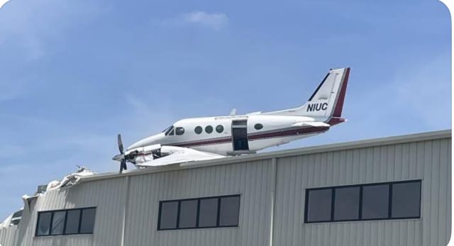 Beechcraft King Air 90 (N1UC) - In advertent landing on top of hangar.