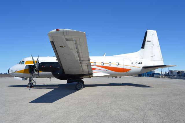 Hawker Siddeley HS-748 (CRQ649) - Waiting to offload cargo in Kashechewan, Ontario, a common occurrence here.