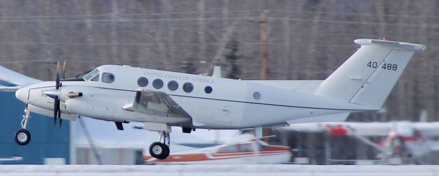 — — - USAF Huron taking off.