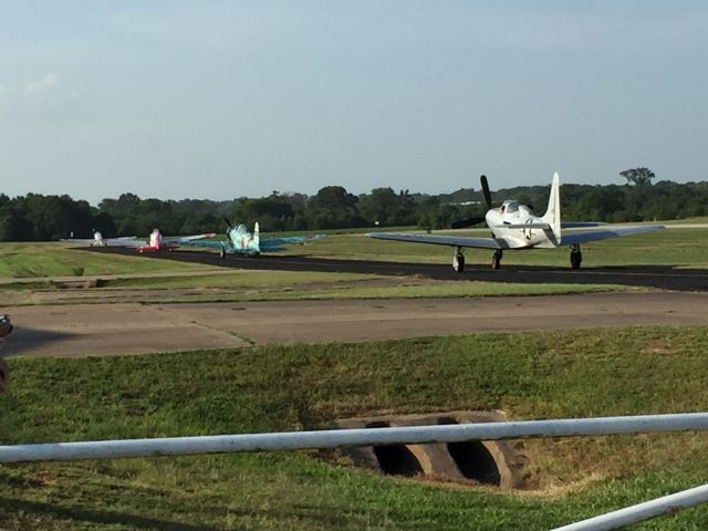 — — - Aircraft preparing for takeoff prior to the Cedar Creek Lake military commemoration