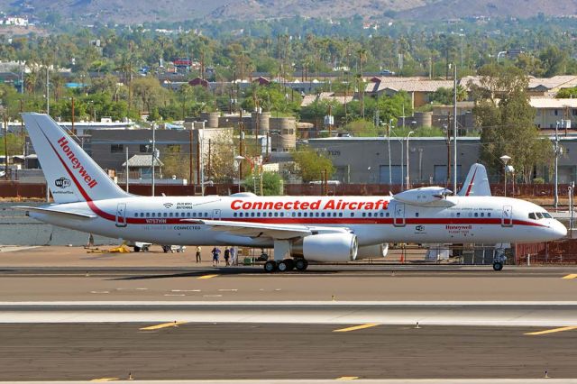 Boeing 757-200 (N757HW) - Honeywell Boeing 757-225 N757HW engine testbed at Phoenix Sky Harbor on July 22, 2018. It has a TPE331-14 turboprop engine installed on its test pylon. A spinner and sharks mouth and eyes inspired by the P-40s of the Flying Tigers have been addded to the nacelle.