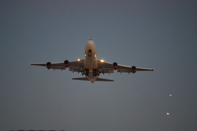 Boeing 747-400 — - Dusk departure for England.