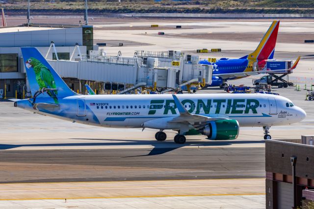 Airbus A320neo (N309FR) - A Frontier Airlines A320 neo "Juan the Puerto Rican Parrot" taxiing at PHX on 2/10/23 during the Super Bowl rush. Taken with a Canon R7 and Canon EF 100-400 II L lens.