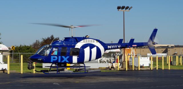 Bell JetRanger (N11TV) - LINDEN AIRPORT-LINDEN, NEW JERSEY, USA-SEPTEMBER 03, 2019: A news helicopter belonging to one of the local New York City television stations is pictured taking off shortly after refueling.