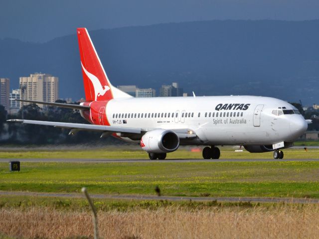 BOEING 737-400 (VH-TJS) - On taxi-way heading for take off on runway 05. Thursday 12th July 2012.