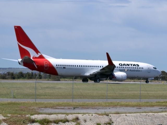 Boeing 737-800 (VH-VYC) - On taxi-way heading for take off on runway 05.