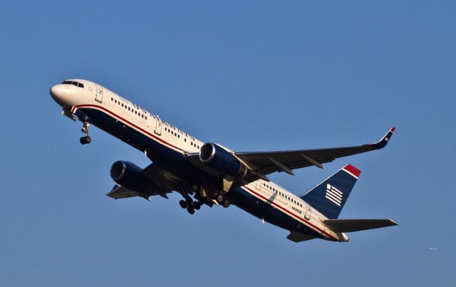 Boeing 757-200 (N939UW) - An evening take-off on runway 36R of an old work horse. It is equipped with powerful Rolls-Royce RB-211 engines. Just past mid field, its high in the sky and  and pulling up the landing gear.