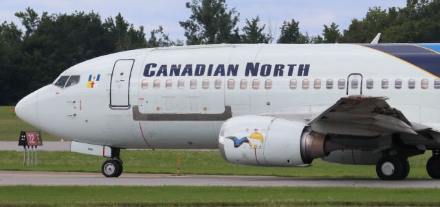 BOEING 737-300 (C-GZCN) - Canadian North Boeing 737-300 “Quick Change” Combi (C-GZCN) flying as “Arctic 129” to YFB on Taxiway Echo holding for Runway 32 at YOW on 13 Aug 23.  Aircraft was delivered to Go Fly UK in 1999 and joined Canadian North in 2013.  Kelowna Flightcraft did the Combi conversion in 2014.