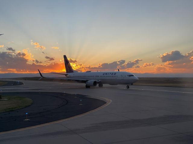 Boeing 737-800 (N79541) - Photo from plane on west ramp, looking towards plane coming from taxi. Sunset