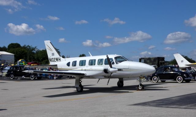 Piper Navajo (N102WH) - Catching some display time is this Piper Navajo Chieftain PA-31-350 in the Summer of 2019 on this "Wings and Wheels" airport celebration.