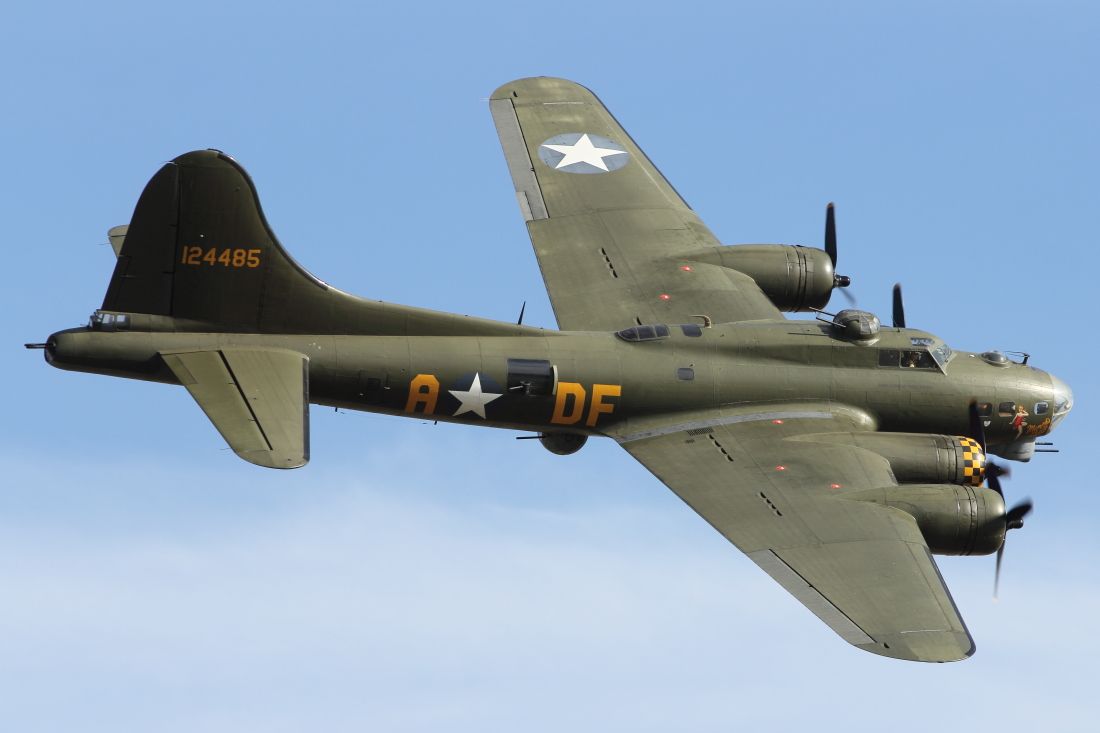 — — - Memphis Belle, Boeing B-17 Flying Fortress, performs a flypast at Duxford Air Museum.