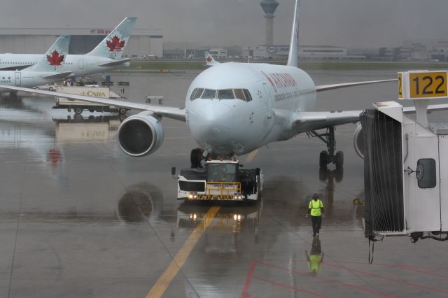 — — - Being towed into gate at CYYZ