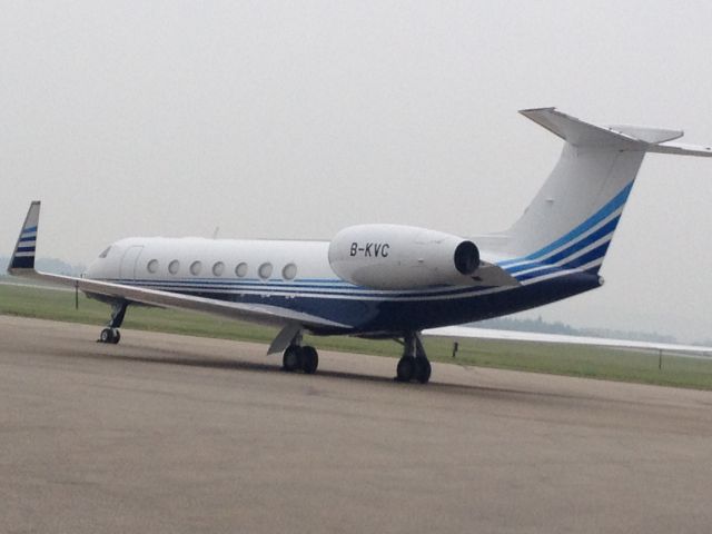 Gulfstream Aerospace Gulfstream V (B-KVC) - On ramp at FBO in smokey CYQU, me wondering what the heck is this doing here...