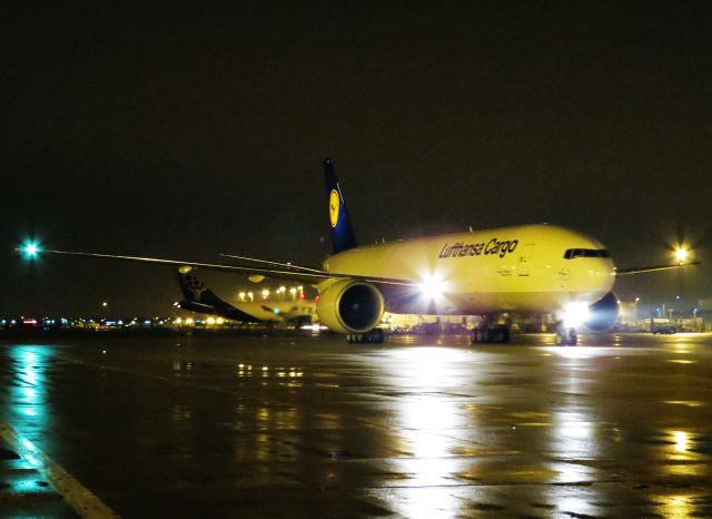 Boeing 777-200 (D-ALFA) - Air-side with Lufthansa Cargo's first Boeing 777 Freighter...I'm calling this plane "Alpha Male."