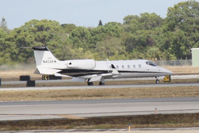 Learjet 55 (N424KW) - Marlin Flight 62 (N424KW) arrives on Runway 14 at Sarasota-Bradenton International Airport following a flight from Opa-Locka Executive Airport