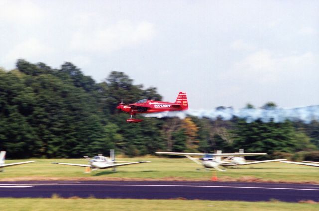 STEPHENS Akro (N10LL) - SUSSEX AIRPORT-SUSSEX, NEW JERSEY, USA-AUGUST 1994: Pictured at the 1994 Sussex Airshow, flying his Akro Laser 200, is former U.S. National and World Aerobatic Champion Leo Loudenslager. Always a favorite with the crowd, Leo would return each year, schedule permitting, to perform at Sussex.