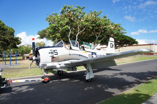 N787AS — - A T-28B being towed through Joint Base Pearl Harbor Hickam housing during a parade of warbirds.  The warbirds were on O'ahu to participate in the 75th Anniversary of VJ Day activities.  This T-28B will be loaded onto the USS Essex and shipped back to the mainland with 13 other warbirds after spending three weeks on and above O'ahu.