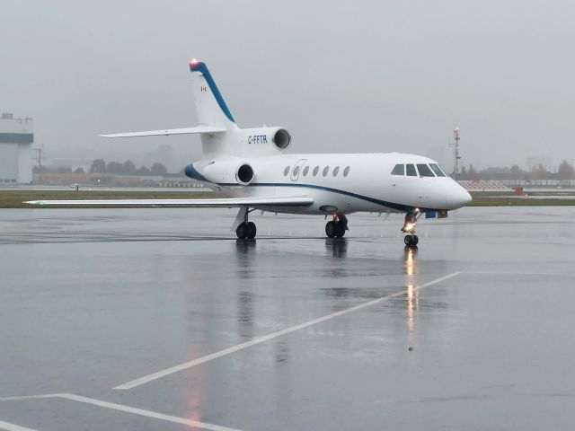 Dassault Falcon 50 (C-FFTR) - Arriving late afternoon in wet weather.