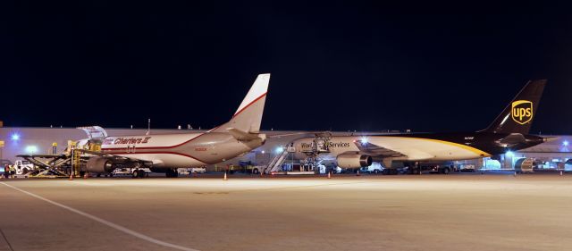 BOEING 737-400 (N730CK) - A Kalitta Charters B734 (N730CK) is fully loaded and only a few minutes from being buttoned up for departure to Phoenix in this night shot on the Reno-Tahoe International cargo ramp. 